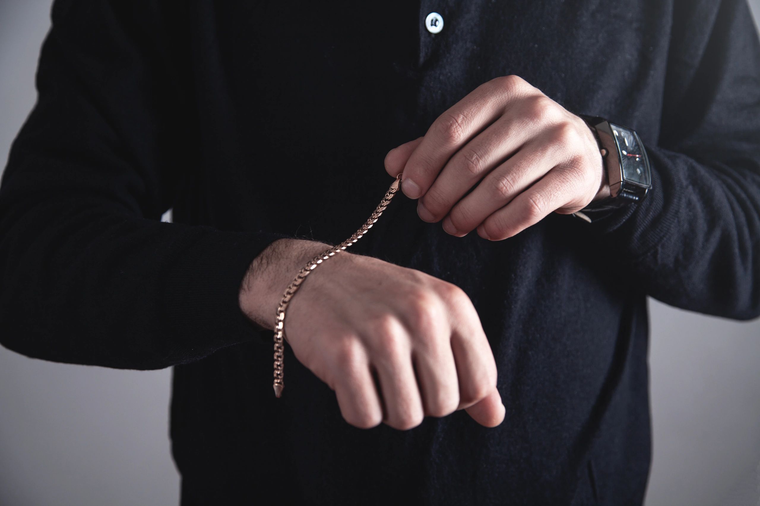 men's bracelets on black background
