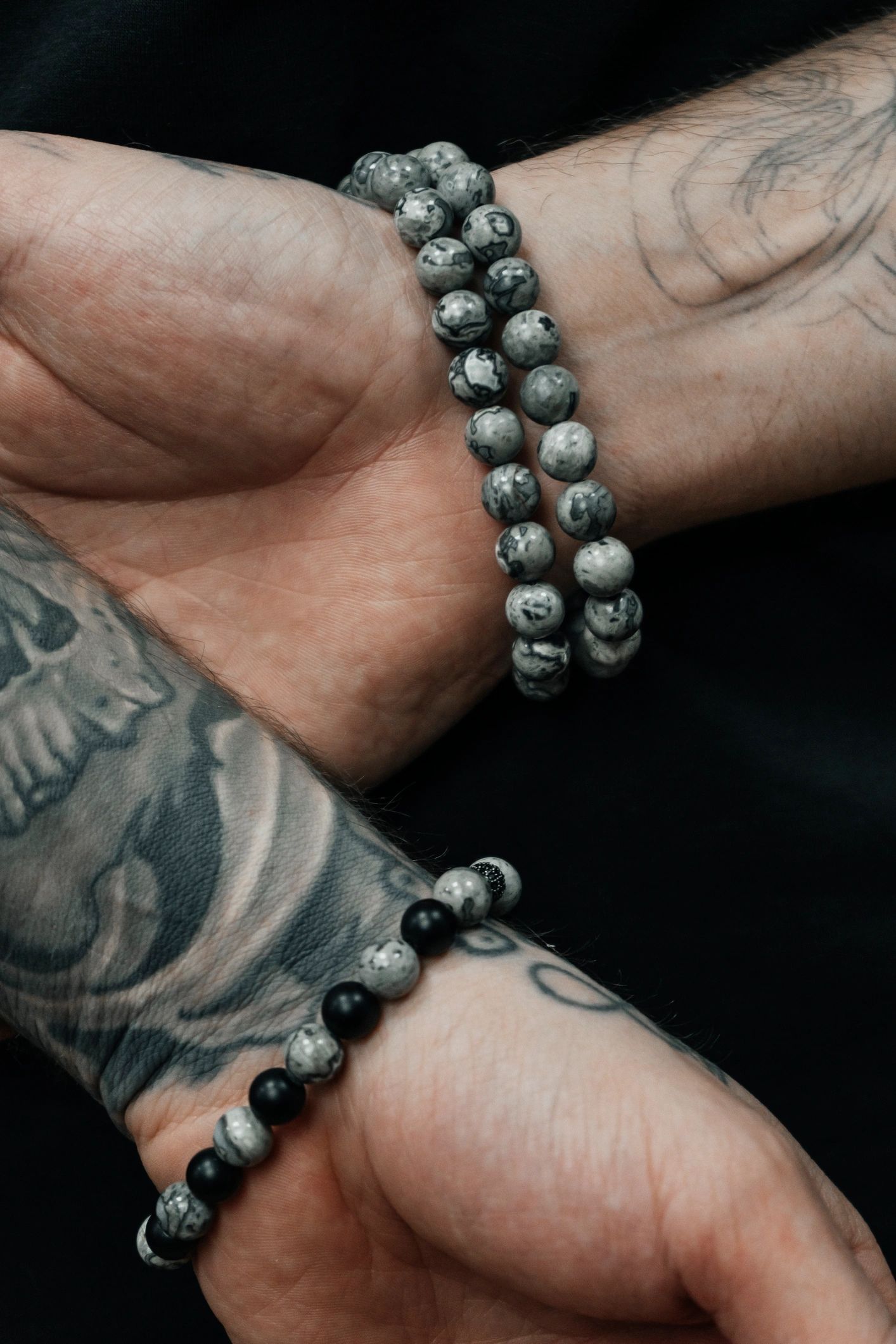 men's bracelets on black background